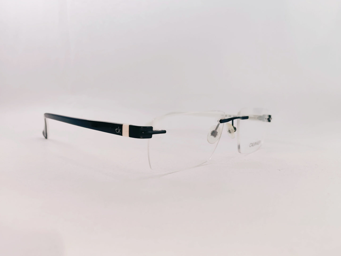 Calvin Klein Eyeglasses Calvin Klein- Rimless Rectangle Specs For Men 280533