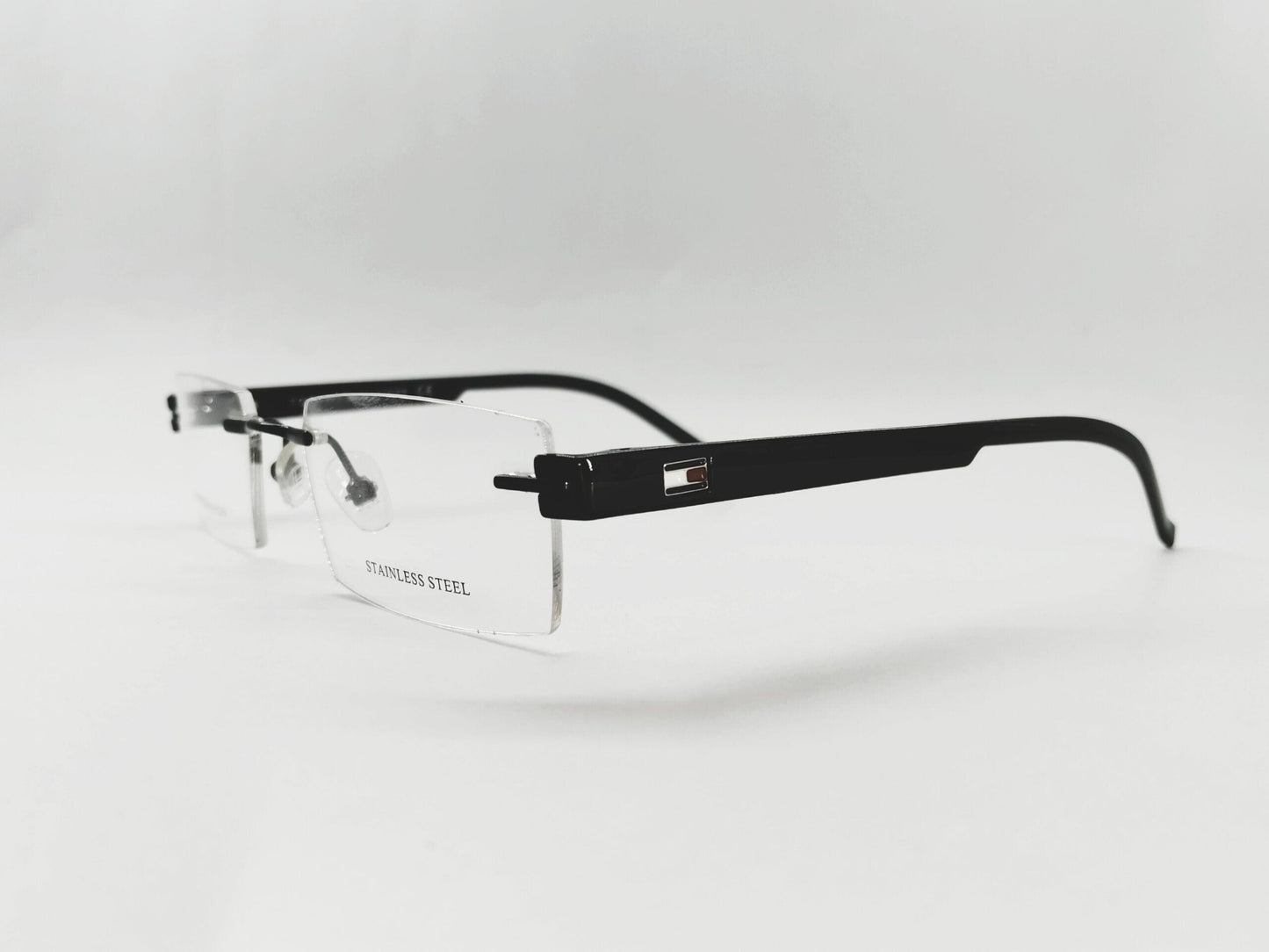 Tommy Hilfiger Eyeglasses Tommy Hilfiger Rimless Rectangle Specs For Men & Women 166315