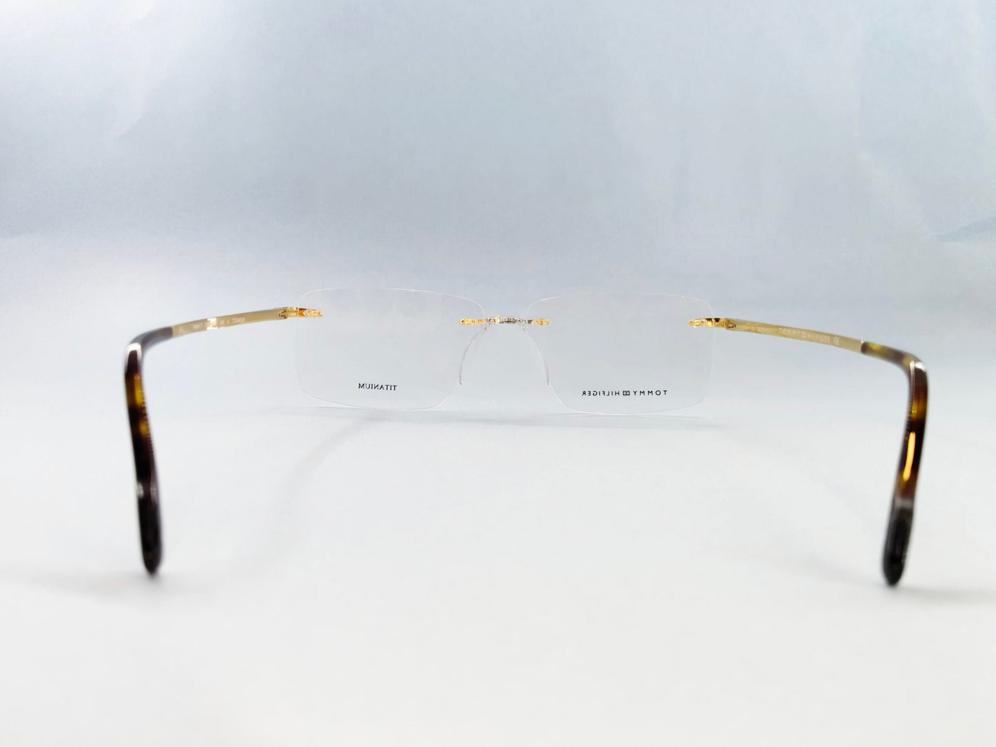 Tommy Hilfiger Eyeglasses Tommy Hilfiger Rimless Frame for Men & Women 213454