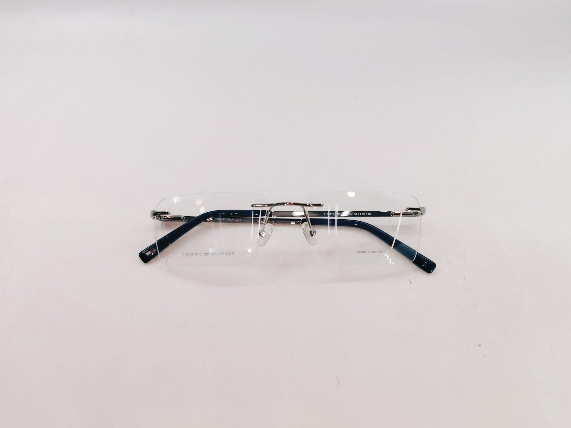 Tommy Hilfiger Eyeglasses Tommy Hilfiger Rimless Rectangle Specs For Men & Women 272462