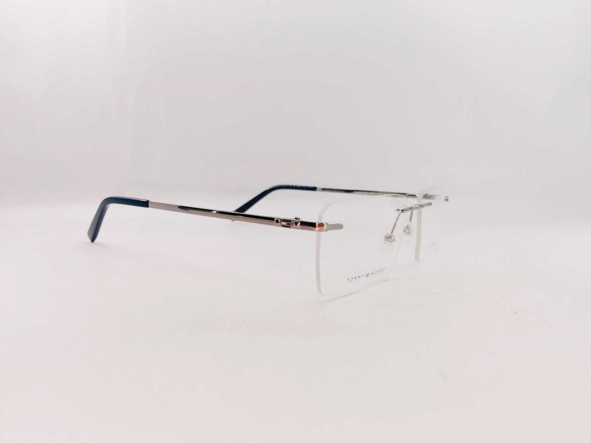Tommy Hilfiger Eyeglasses Tommy Hilfiger Rimless Rectangle Specs For Men & Women 272462