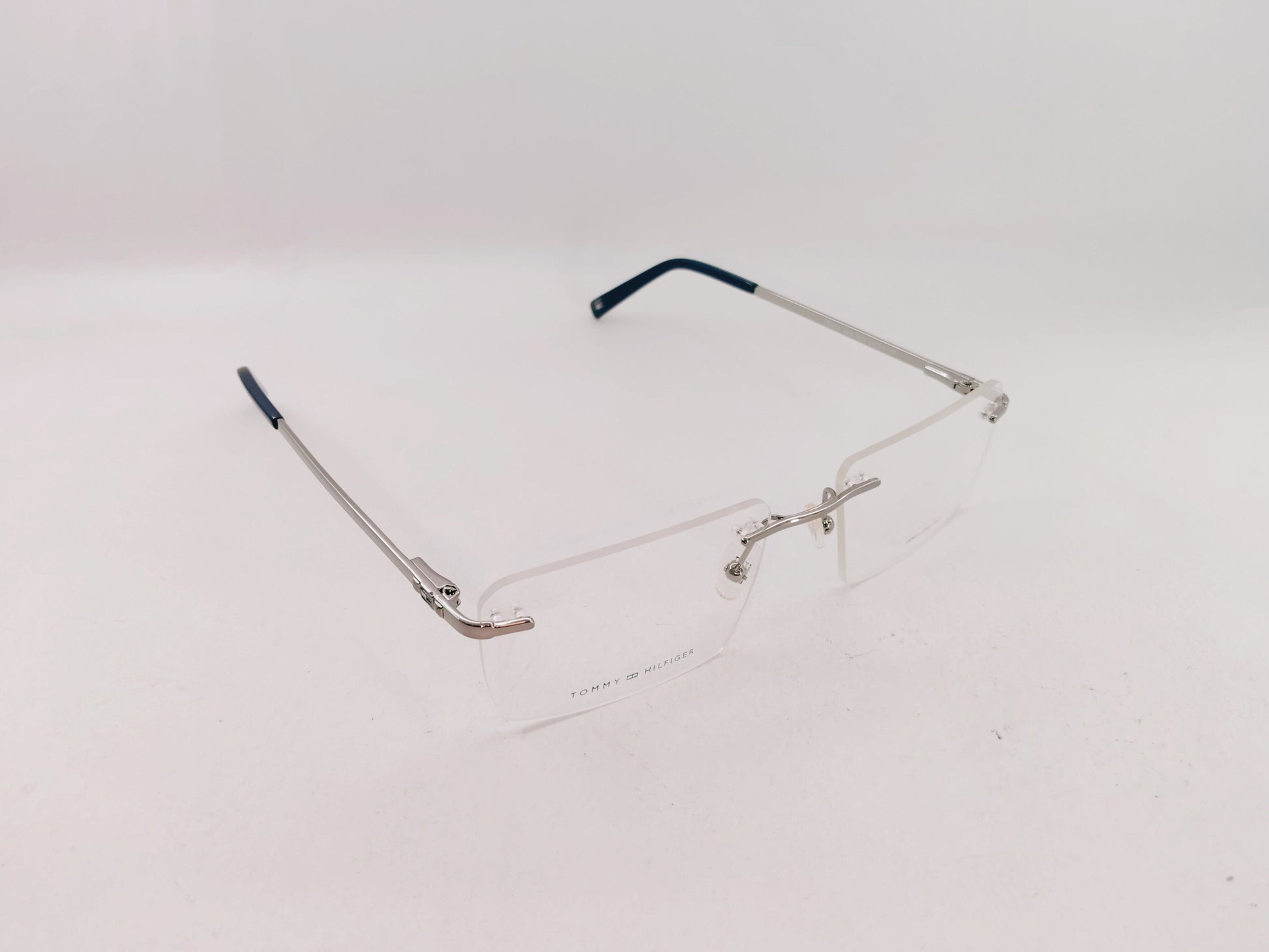 Tommy Hilfiger Eyeglasses Tommy Hilfiger Rimless Rectangle Specs For Men & Women 272462